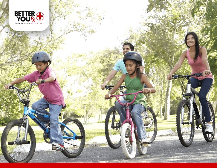 two children with parents riding bike to prevent obesity 