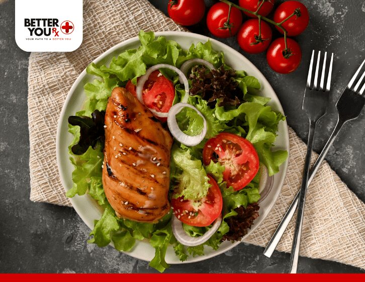 Meat and vegetables with tomato on the plate