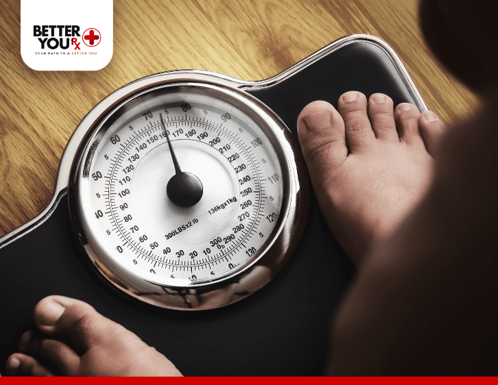 Woman checking her Weight in weighing scale