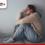 woman sitting on side with Depression and Anxiety