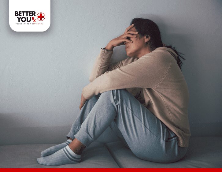 woman sitting on side with Depression and Anxiety