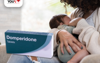 Mother holding baby with Domperidone box