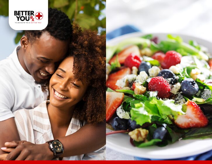 Happy couple embracing alongside a fresh berry salad with greens, walnut, and cheese | Better You Rx