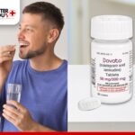 Man taking Dovato tablet with water, promoting effective HIV treatment and support | Better You Rx