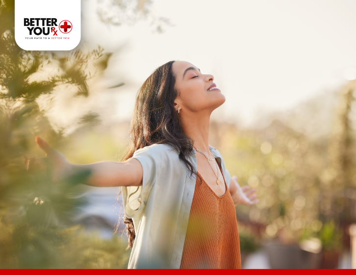 woman standing outdoor felling the sunlight