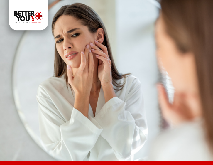 woman checking her face on the mirror