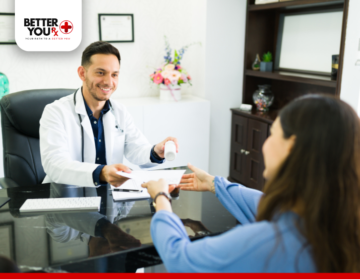 Doctor giving female patient prescription wearing blue clothes