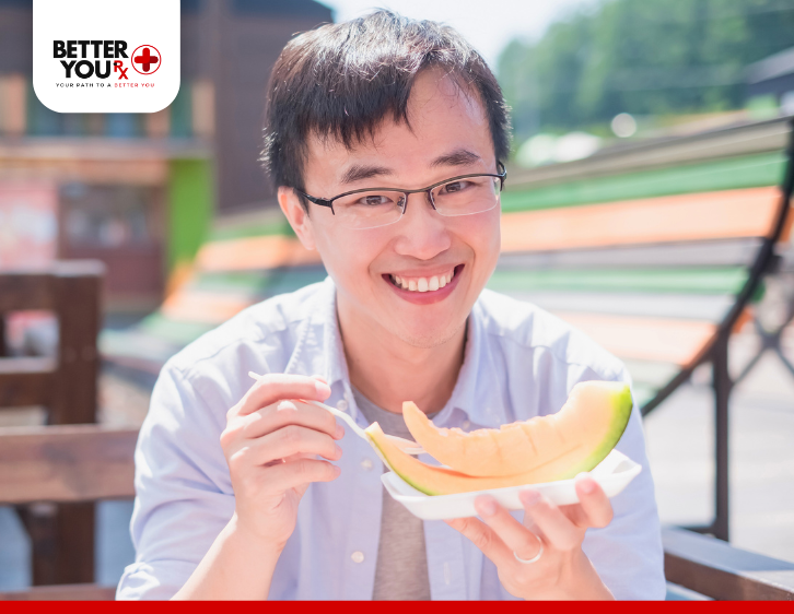 Man eating Cantaloupe