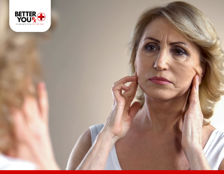 Woman checking ozempic face changes in the mirror