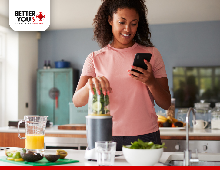 woman using blender for food