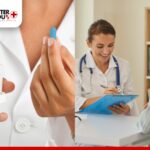 Doctor holding a blue pill, writing on a clipboard during a patient consultation | Better You Rx