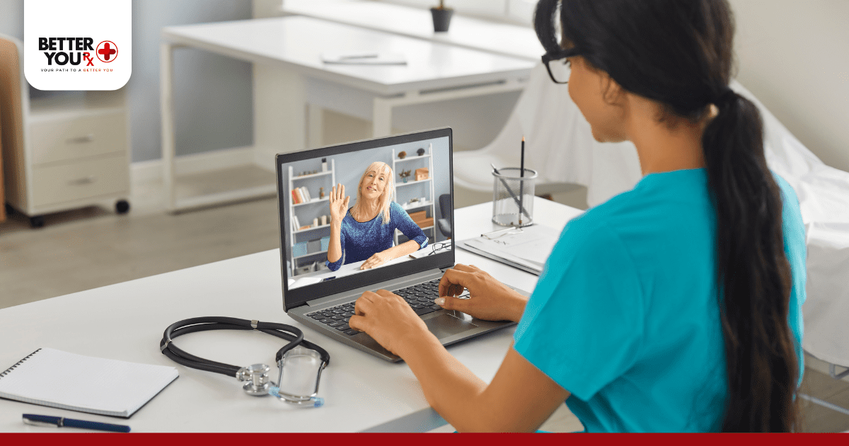 pharmacist in a video call with a patient on a laptop