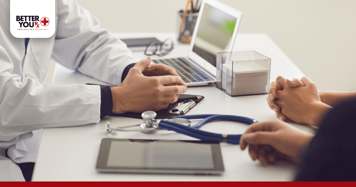 close up of a doctors hand & patient talking about the side effects of ozempic