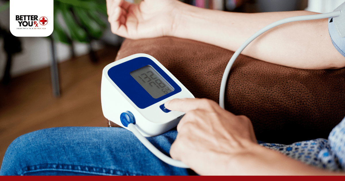close up of a person using a digital monitor for blood pressure